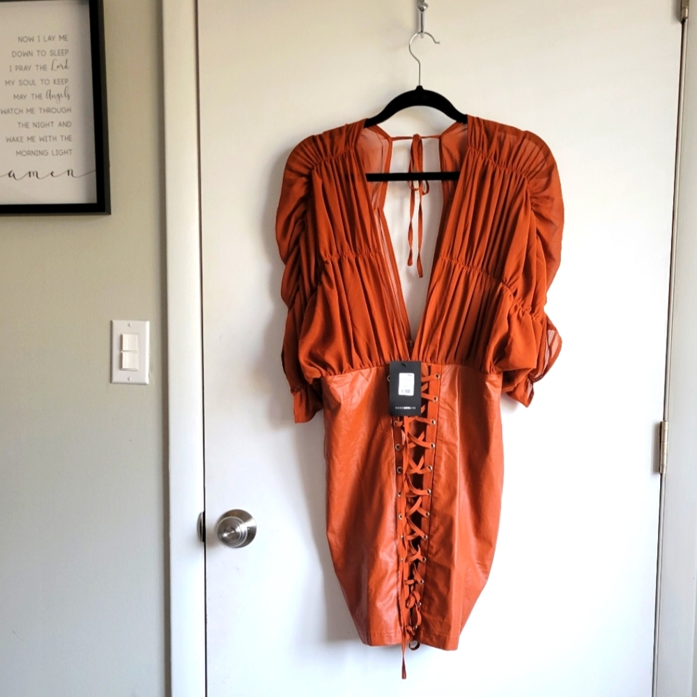 Faux leather dress with shear open top!